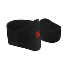 A pair of black Laceeze MAX Bands with red logo, designed to secure shoelaces on sports footwear.