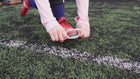 Translucent Laceeze band covering a football boot