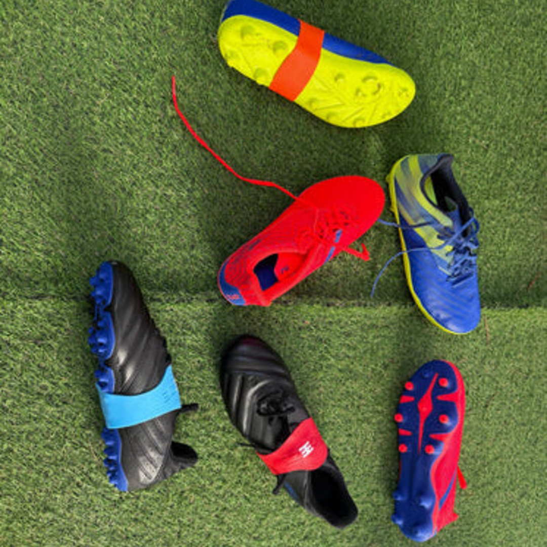 a selection of football boots laying on astro some with Laceeze