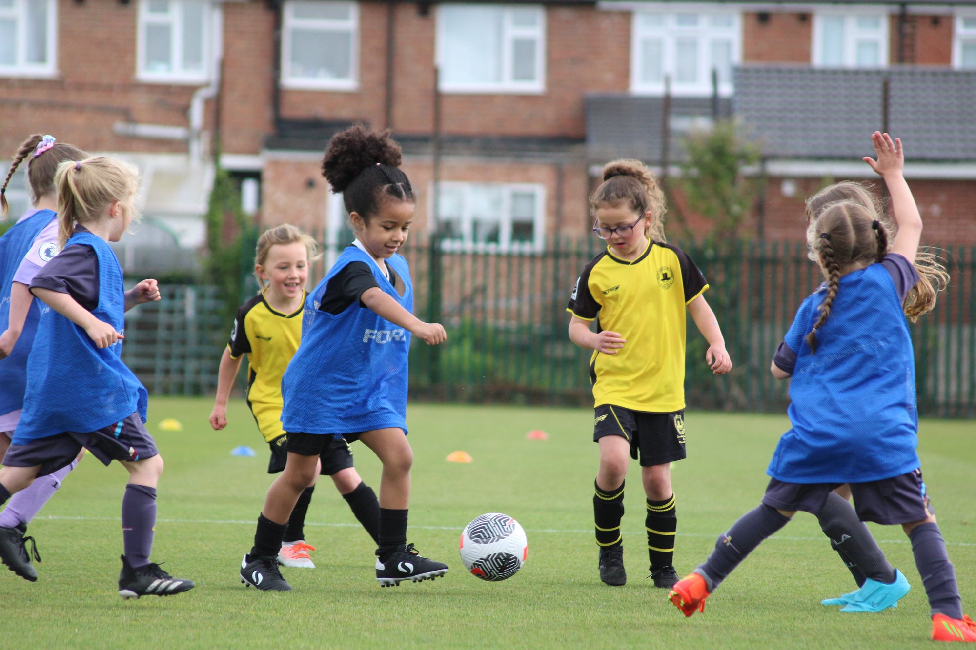 Young girls playing football. Wildcats 
